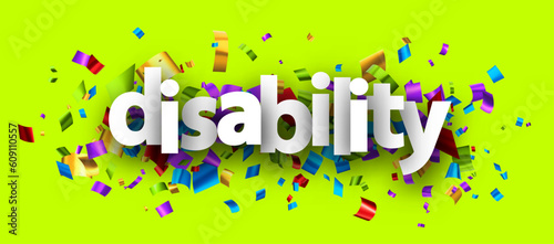 Disability sign over cut out foil ribbon confetti background.