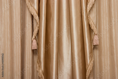 Hanging beige curtain photo