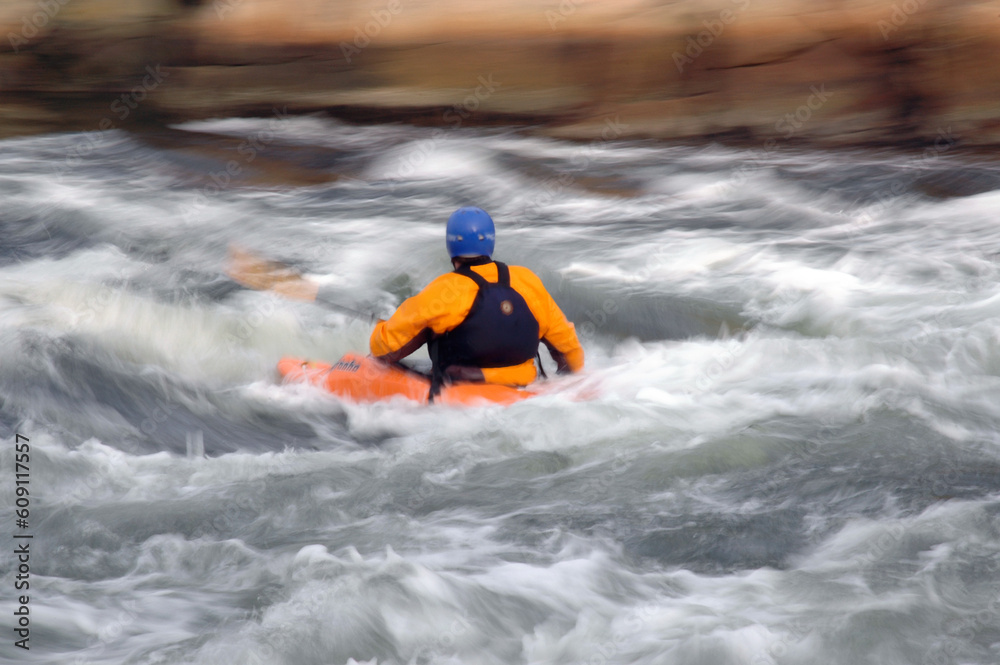 A kayaker in white water.