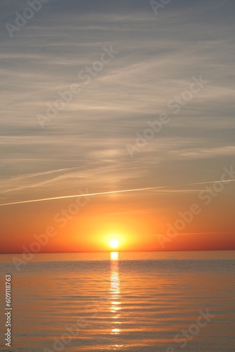 Moment when sun reaches the horizon. © Designpics