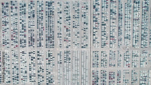 Aerial view of Cargo port full of cars. Cars and containers ready to be transported further