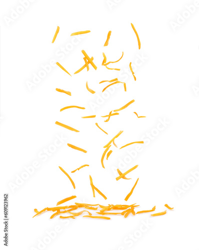 Grated cheese falls on a white background