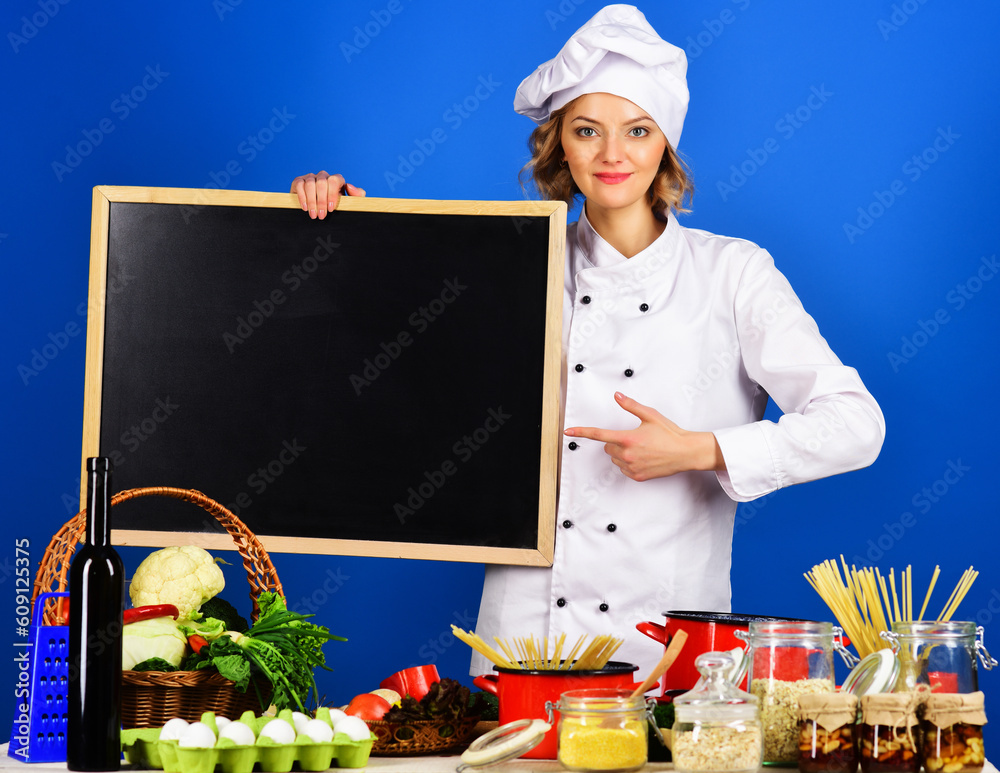 Young african american cooker girl wearing uniform and hat holding tray  with dome very happy pointing with hand and finger to the side Stock Photo