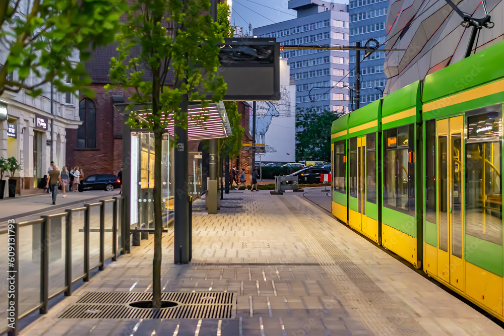 Obraz na płótnie Poznań, Poland -27.05.2023- running greens and yellow trams in Poznań w salonie