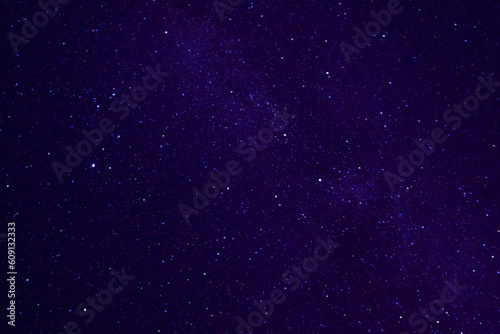 Dark blue night starry sky. Space background. Milky Way and star on dark background. Universe filled with stars. Space galaxy © fatima