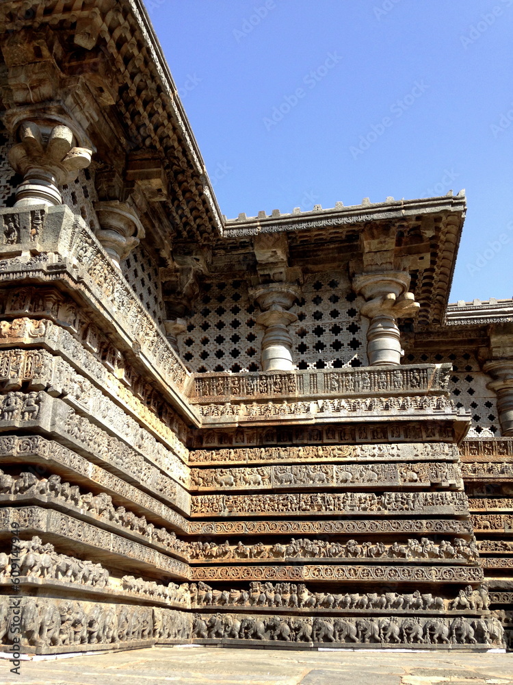 Intricately carved plinth and base of Hoyasaleshwara temple in Halebid, India.