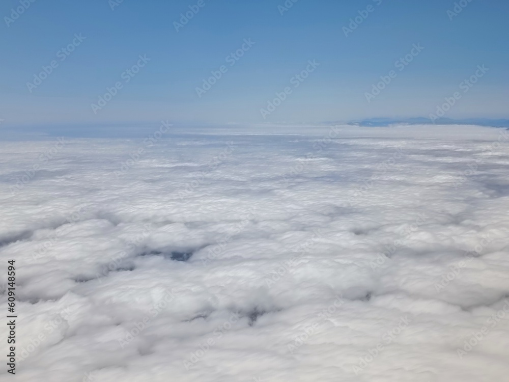 above the clouds, airplane view