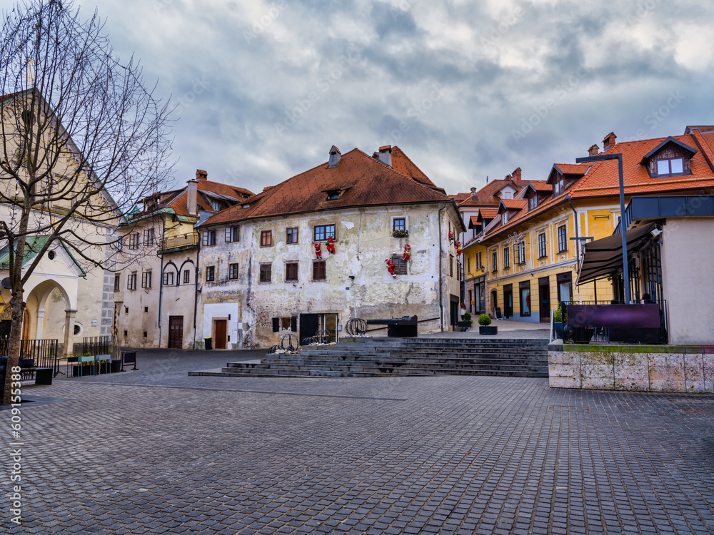 Cobblestone street and old houses in Skofja Loka village, Slovenia
