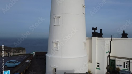 Flamborough Head Lighthouse is an active lighthouse located at Flamborough, East Riding of Yorkshire. England. Flamborough Head Lighthouse acts as a waypoint for passing deep sea vessels  photo