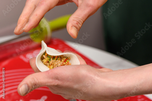 cooking traditional chinese transparent dumplings in the kitchen 57