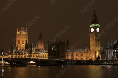Big Ben at night across the Thames river