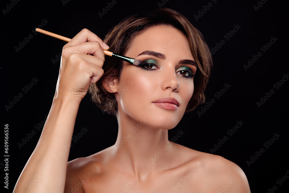 Portrait of chic lady prepare night evening event use brush eye shadows for ideal make up on dark color background Portrait of chic lady prepare night evening event use brush eye shadows for ideal make up on dark color background