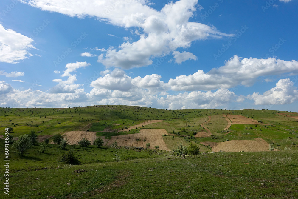 cloudy sky and green landscape, wonderful spring views, green field and hill plateau view,