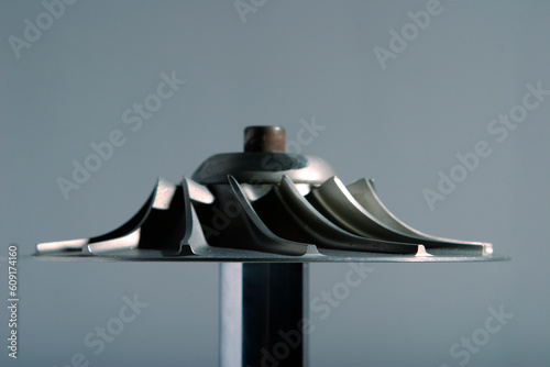 precision engineered turbine with a gray background