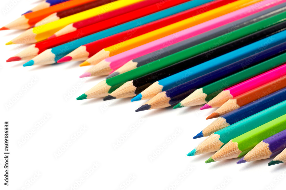Assortment of coloured pencils with shadow on white background Assortment of coloured pencils with shadow on white background