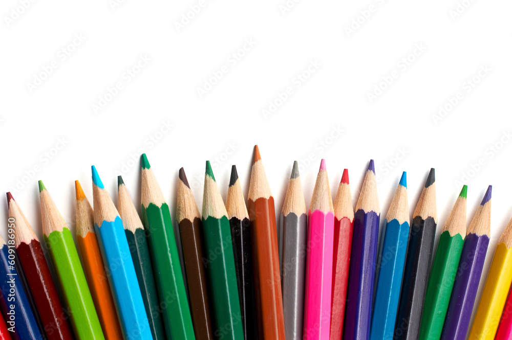 Assortment of coloured pencils with shadow on white background Assortment of coloured pencils with shadow on white background