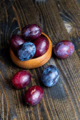 Ripe plums on the table in the kitchen