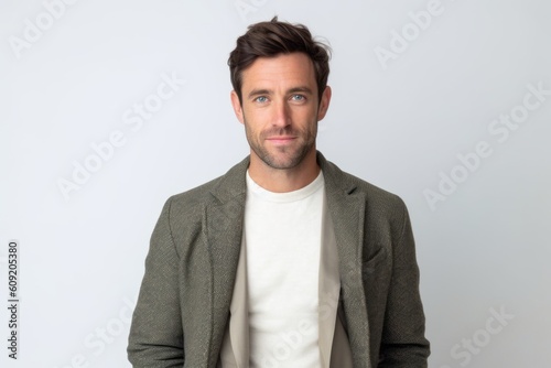 Portrait of handsome man looking at camera over white background. Man looking at camera