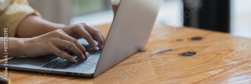 Confident businesswoman using a calculator Document laptop for financial work Calculation on table, tax, report, accounting, statistics. Analytical research concept. Copy space, banner, panorama.