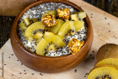 yogurt with the addition of pieces of ripe yellow kiwi with chia and popcorn
