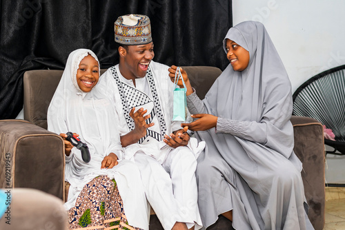 Photography Excited African Muslim family celebrating together