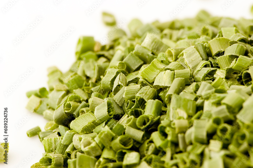 Dried and sliced chives against a plain background Dried and sliced chives against a plain background