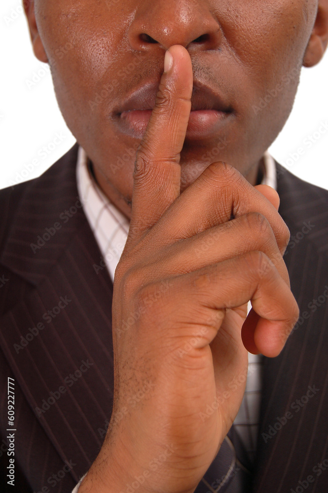 This is an image of businessman with his hands on his lips. This posture implies secrecy, illegal business, trust etc.. This is an image of businessman with his hands on his lips. This posture implies secrecy, illegal business, trust etc..