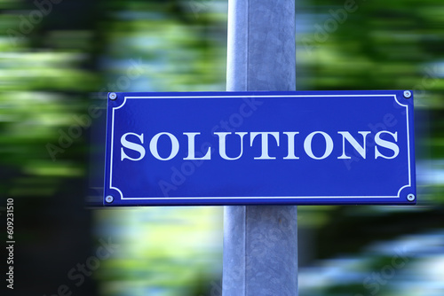 Street sign which says "Solutions"