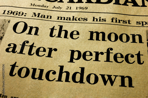 History. Close-up of the headline from a paper, the day after the first man landed on the Moon. photo