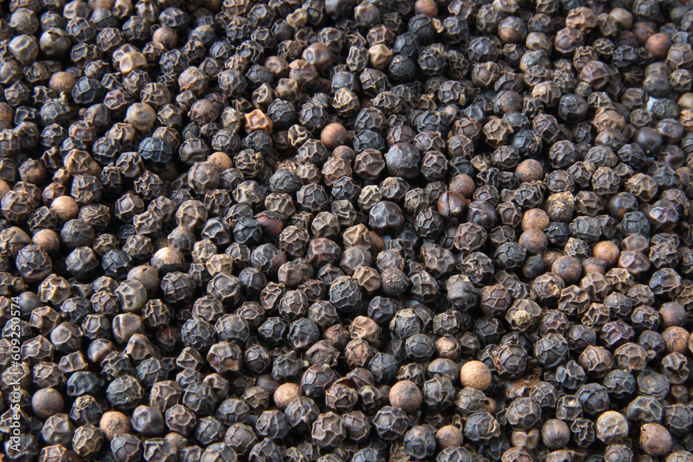 Whole black pepper close-up background Whole black pepper close-up background
