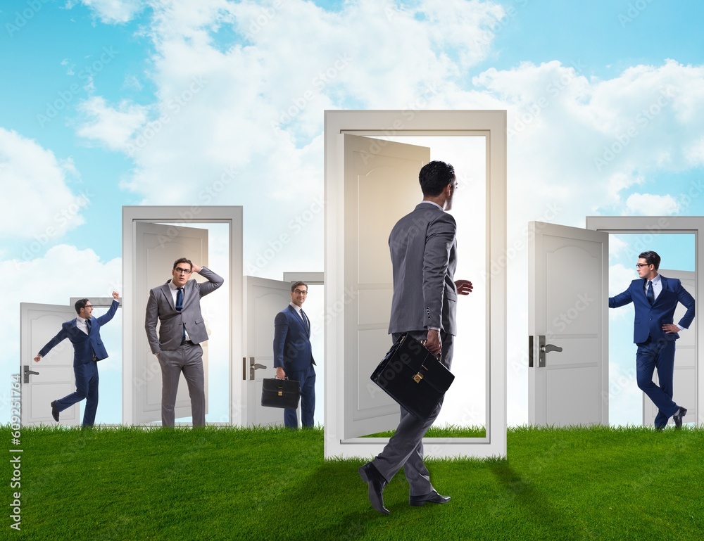 Fototapeta premium Businessman in uncertainty concept with many doors
