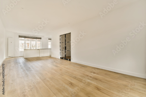 an empty living room with hardwood flooring and white walls in the room is very clean, but there is no furniture