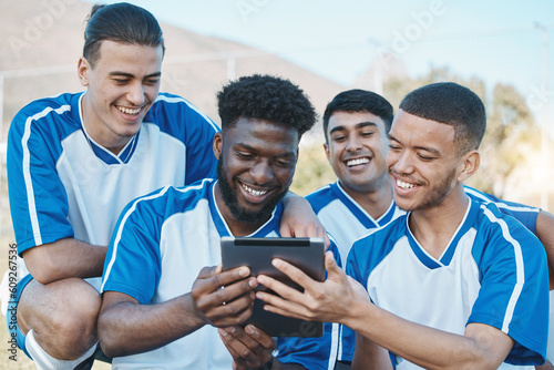 Sports group, team and tablet outdoor on soccer field for fitness training or online planning. Football, club and diversity athlete people or friends with tech to watch competition, game or video