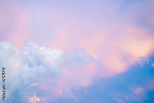 Beautiful evening sky with sun rays shining on the clouds. Selective focus.