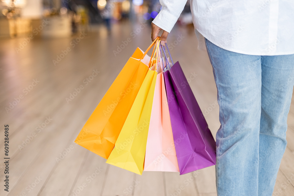 Shopping fashion lifestyle. Women wear holding shopping bag colorful mall. Female relaxation shopping.