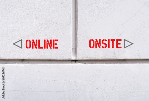 Wall with text and direction to ONLINE and ONSITE, where digital revolution turned conventional working and studying onsite to online , or combination hybrid worldwide after pandemic