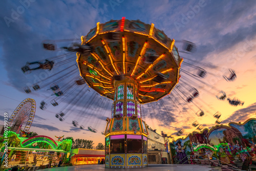 Spinning chairoplane in an amusement park in Germany during sunset photo