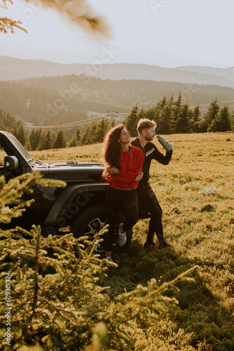 Young couple relaxing by a ...