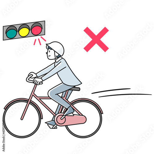 信号を無視して自転車で走る若い男性