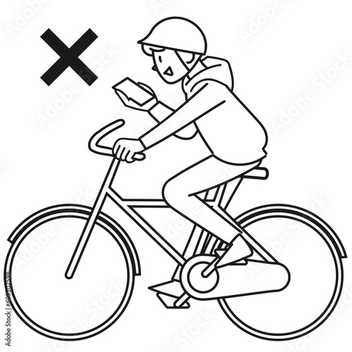 スマホを見ながら自転車で走る若い男性