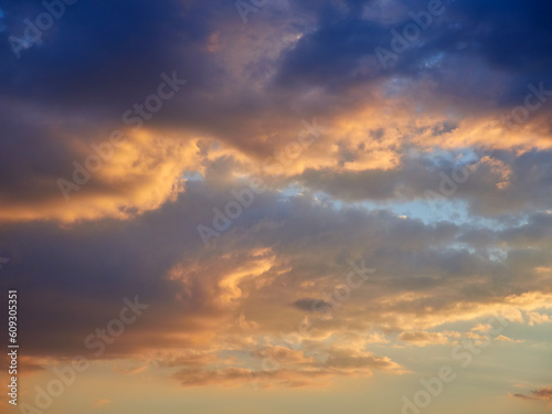 Beautiful clouds in the blue sky during sunset © Sergey