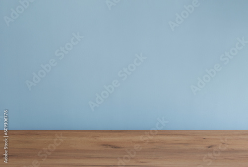 background with modern wooden table and blue wall