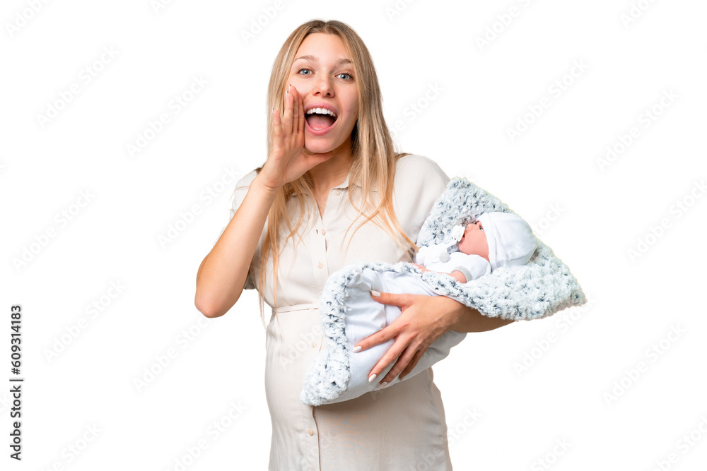 Young pretty pregnant woman with her newborn baby over isolated chroma key background shouting with mouth wide open Young pretty pregnant woman with her newborn baby over isolated chroma key background shouting with mouth wide open