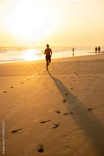 person walking on the beach