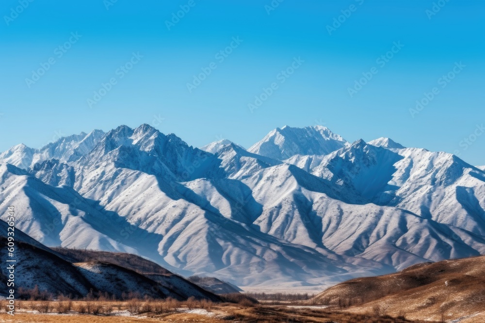 majestic mountain range with snow-capped peaks and clear blue skies, created with generative ai