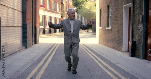 Senior businessman, dance and street in city with happiness, music or celebration with steps. Elderly business man, suit and excited executive for dancing, moving or freedom with energy in metro road