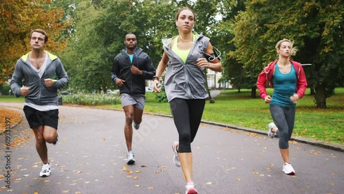 Fitness friends, running in park and cardio with health and wellness, men and women run together in exercise club. People, runner and training for race, solidarity and motivation for workout outdoor