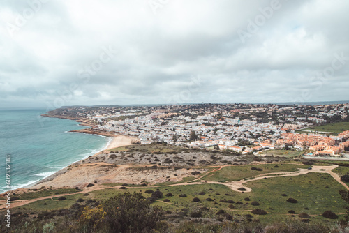 View of the city of Luz and the Atlantic Ocean beaches from the top of Atalaia hill in the Algarve region of southern Portugal. Following in the footsteps of the Fisherman Trail. Rota Vicentina © Fauren