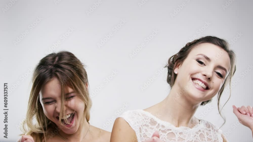 Celebrate, wedding and women dancing for marriage event happy, excited and isolated in a studio white background. Celebration, party and people or young friends, bride and doing crazy dance to music Celebrate, wedding and women dancing for marriage event happy, excited and isolated in a studio white background. Celebration, party and people or young friends, bride and doing crazy dance to music