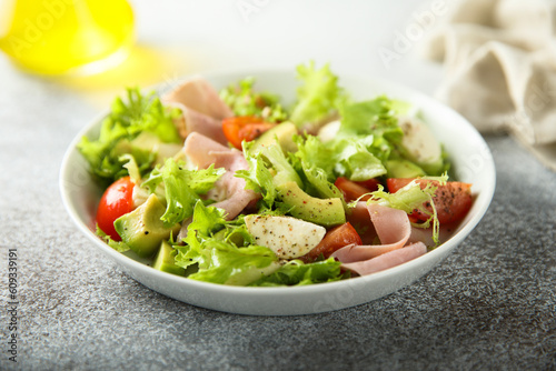 Healthy avocado salad with ham